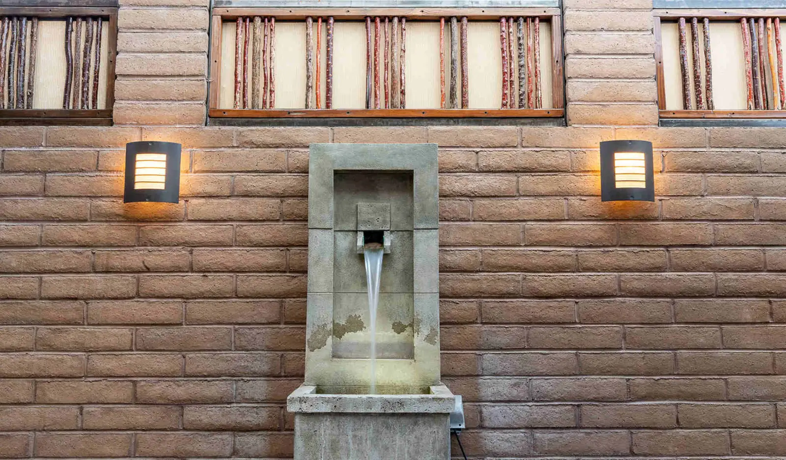 fountain inside luxury outdoor bath at blackstone hotsprings