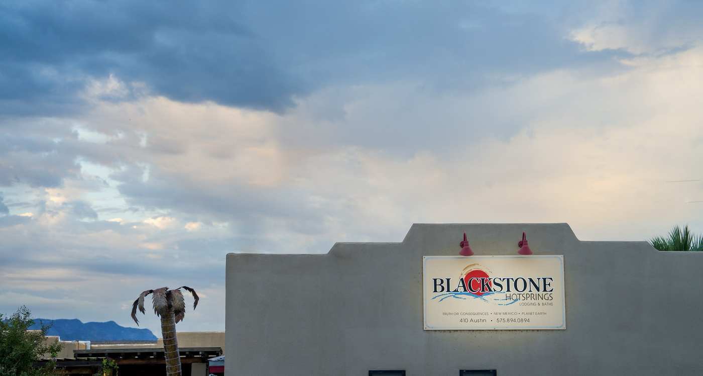 blackstone hot springs sky with parapet and palm tree