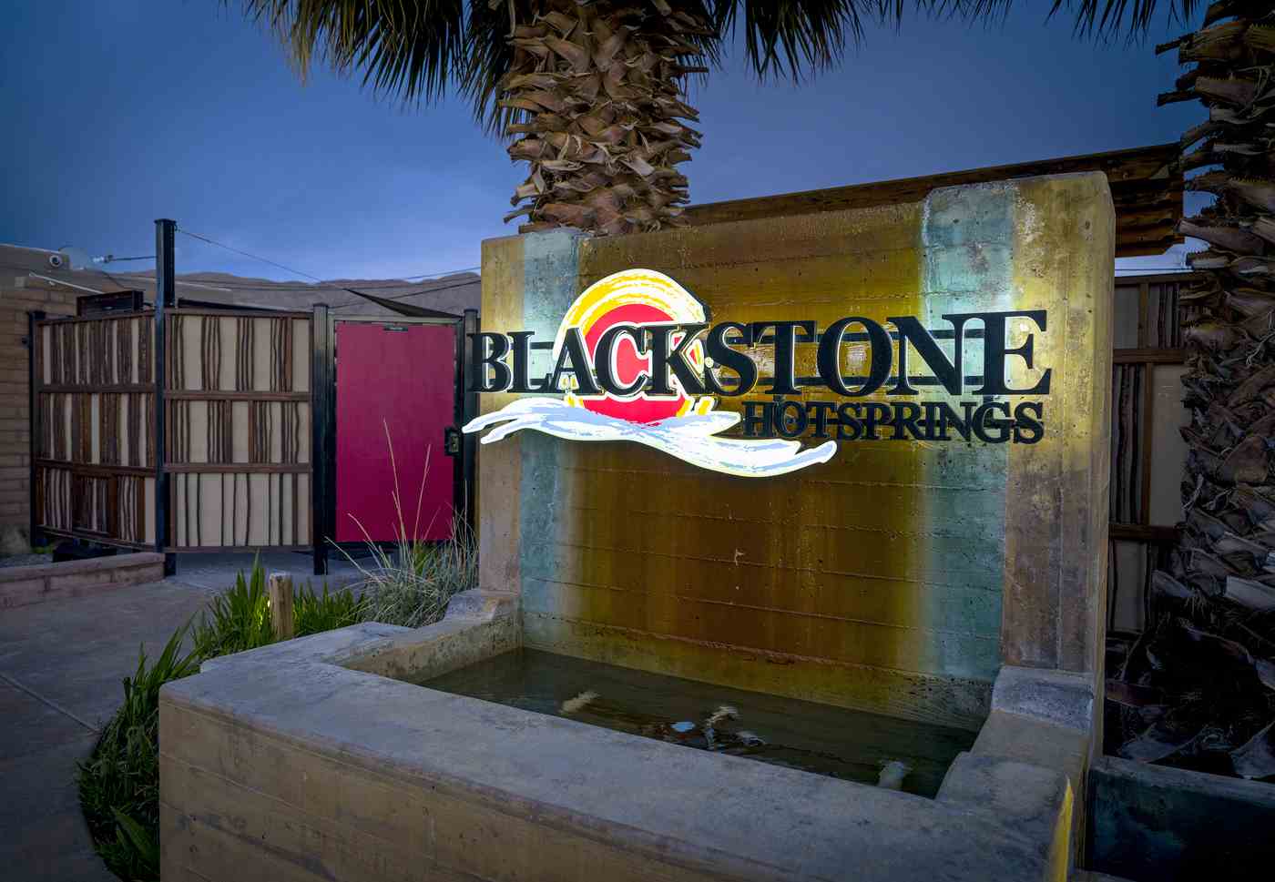 sign of logo at night at blackstone hotsprings